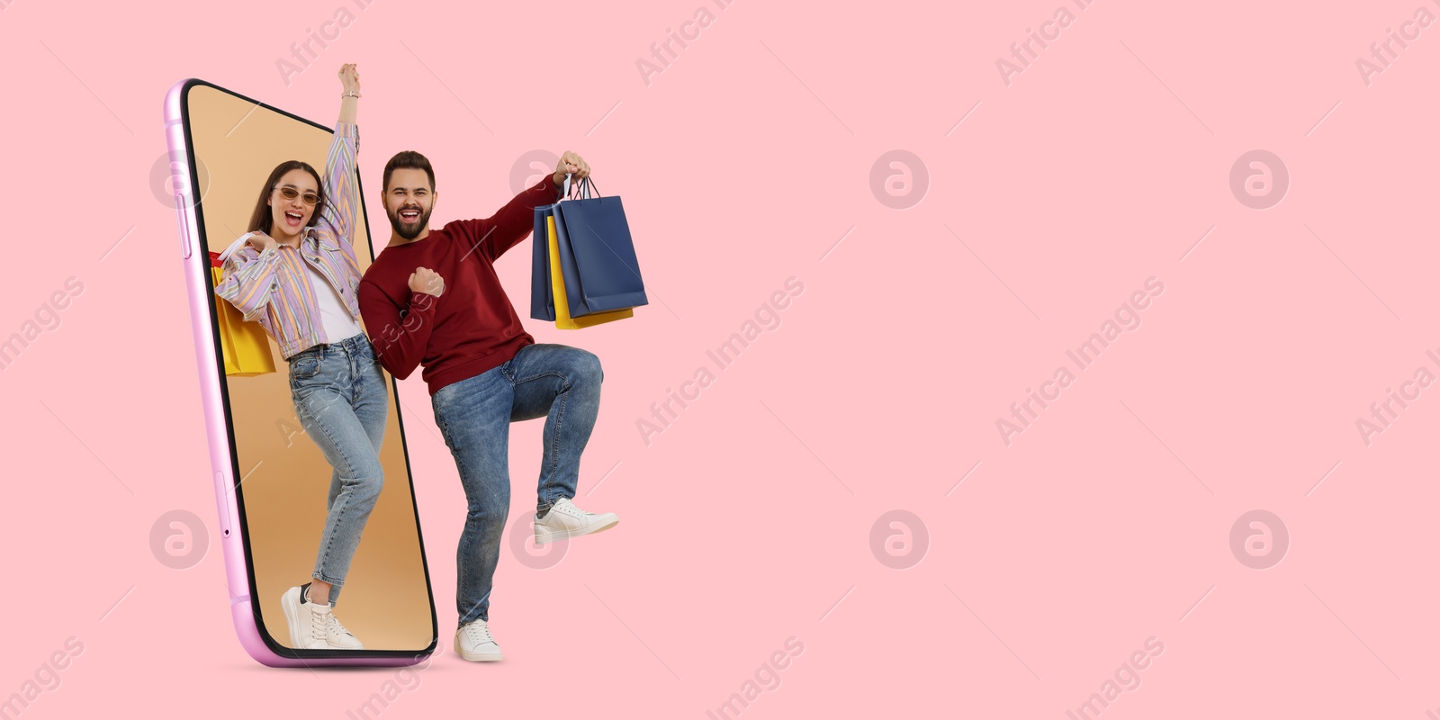 Image of Online shopping. Happy couple with paper bags walking out from smartphone on pink background, space for text. Banner design