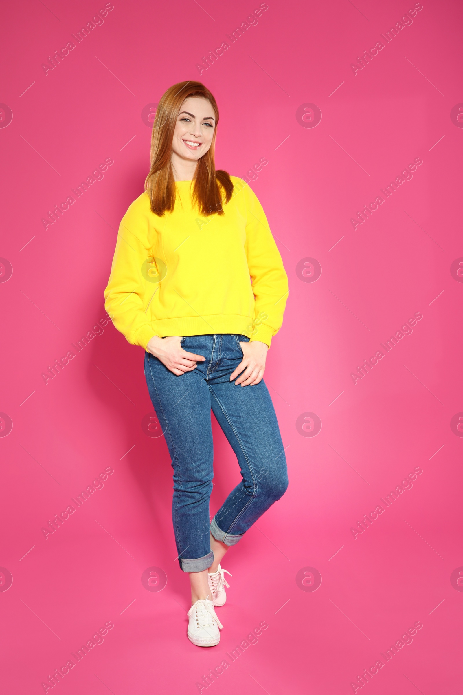 Photo of Full length portrait of beautiful woman on color background
