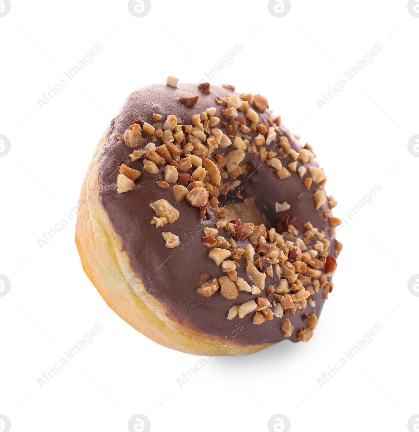 Photo of Tasty glazed donut decorated with nuts on white background