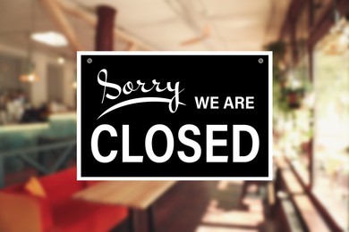 Image of Sorry we are closed sign against blurred background