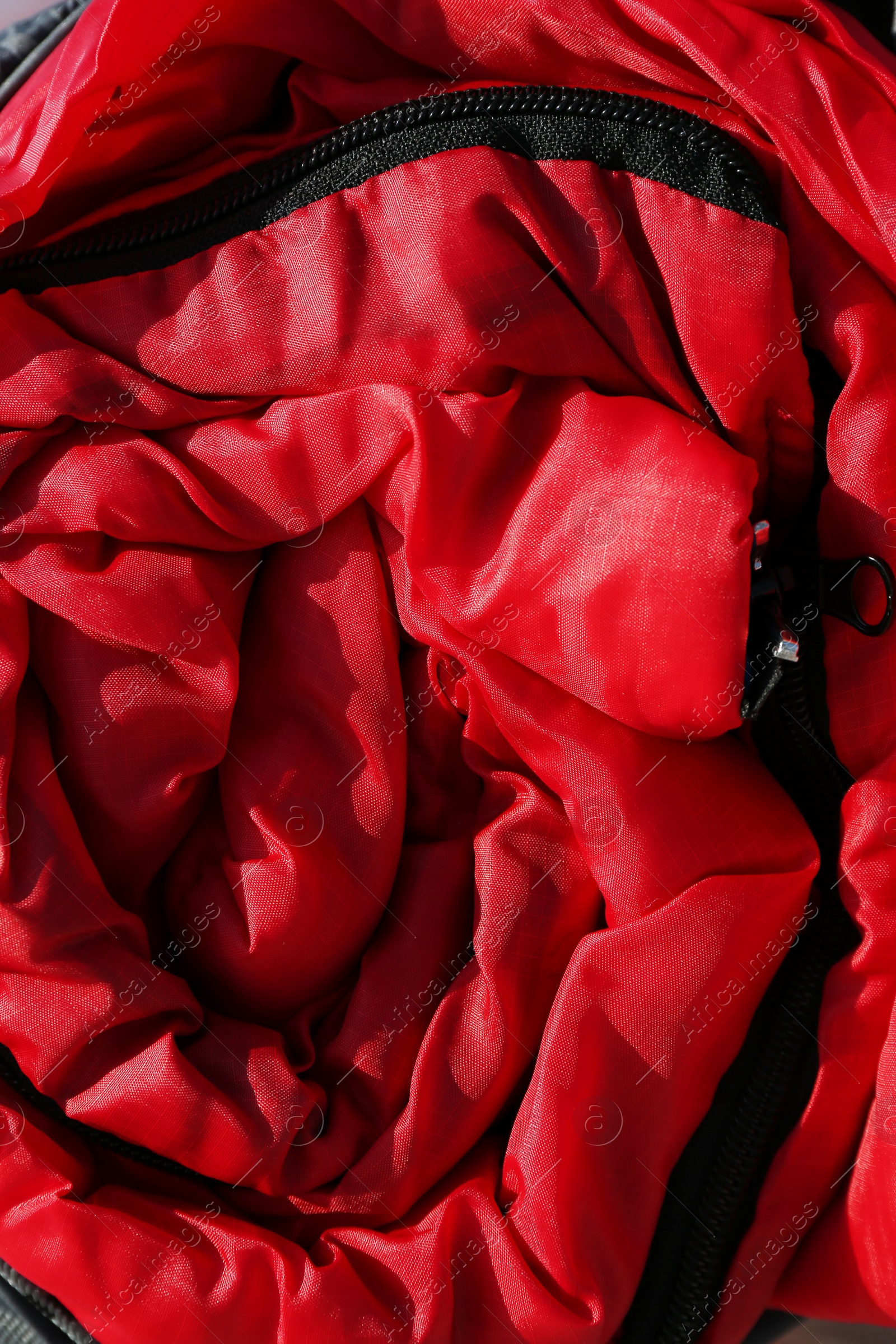 Photo of Rolled sleeping bag, closeup. Professional camping equipment