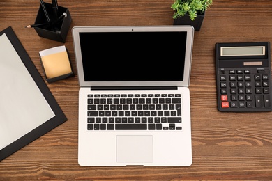 Photo of Flat lay composition with modern laptop on table. Space for design