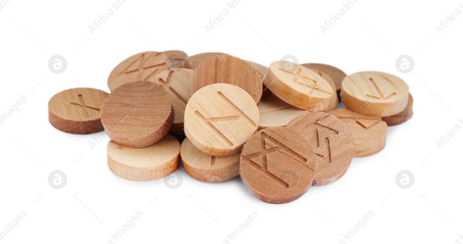 Photo of Pile of wooden runes isolated on white