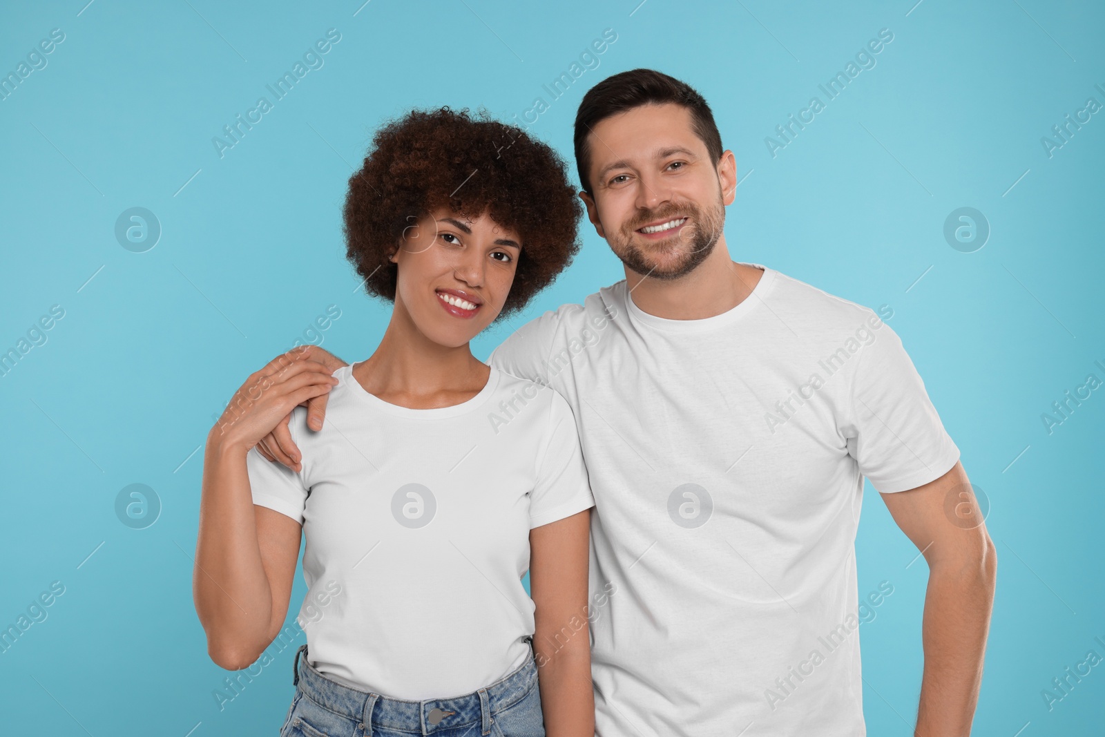 Photo of International dating. Portrait of happy couple on light blue background