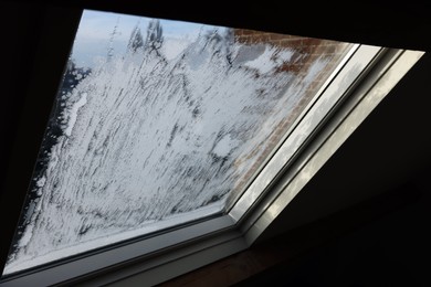 Window covered with beautiful frost. Winter morning