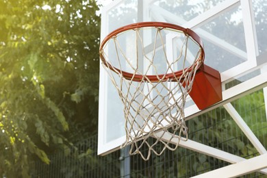 Photo of Basketball hoop with net outdoors, space for text