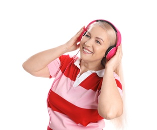 Photo of Mature woman enjoying music in headphones isolated on white