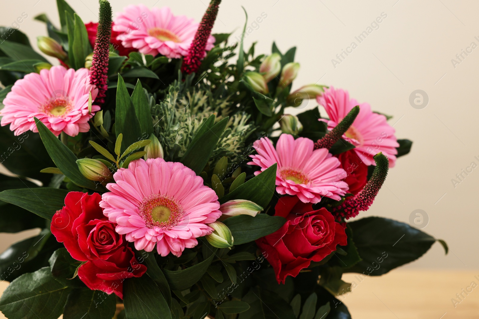 Photo of Bouquet of beautiful flowers on light background, closeup