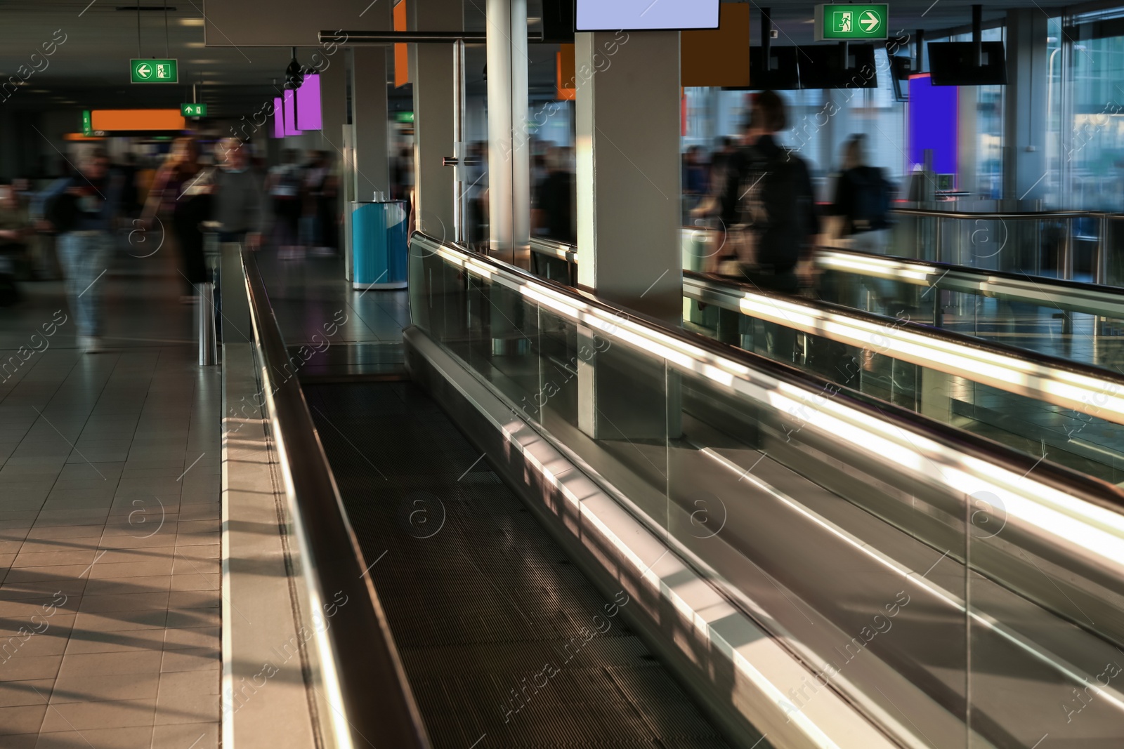 Photo of Interior of airport terminal with travelator. Air travel