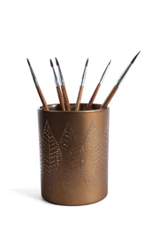 Photo of Holder with different paint brushes on white background