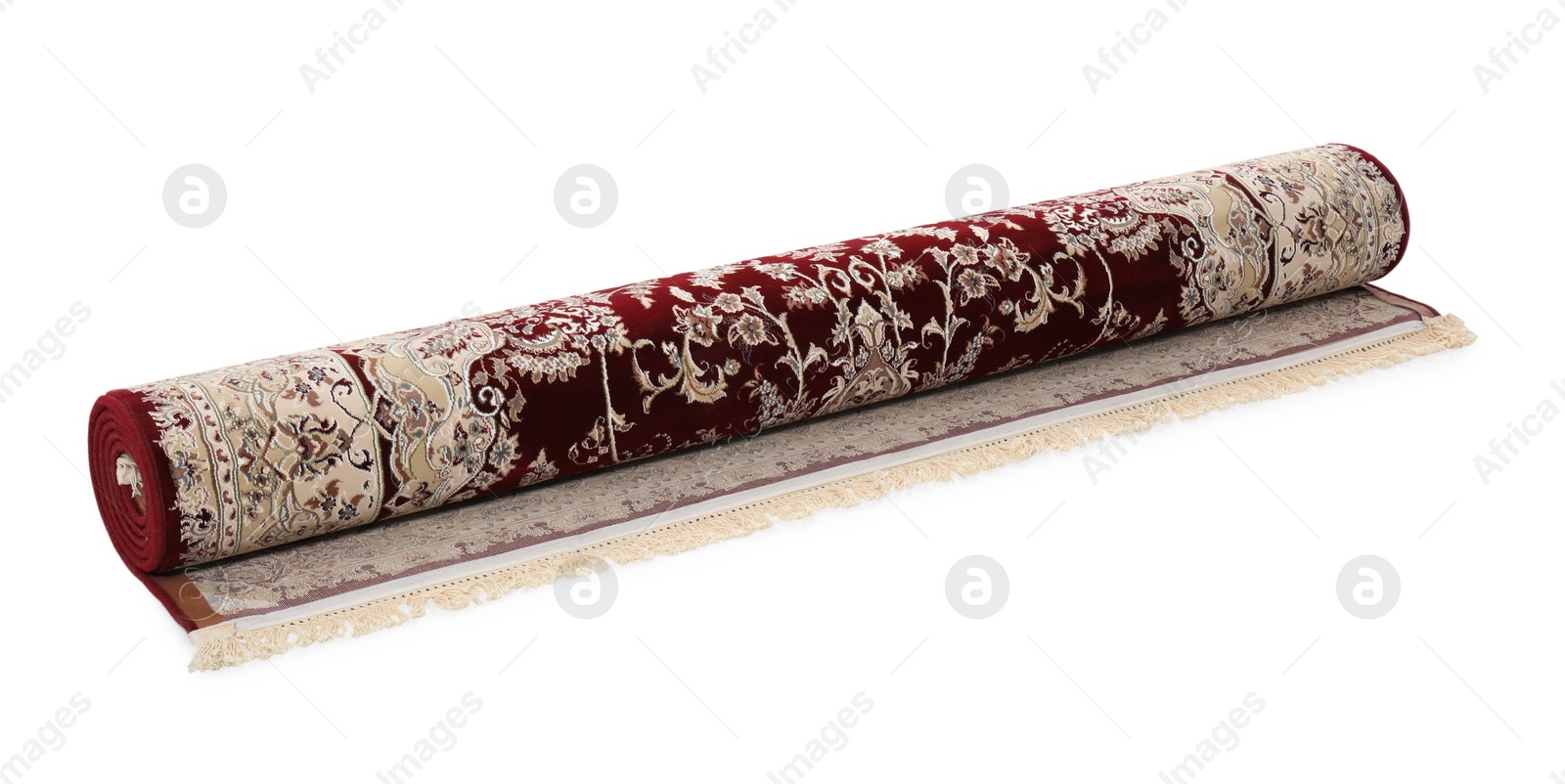 Photo of Rolled carpet with pattern on white background. Interior element