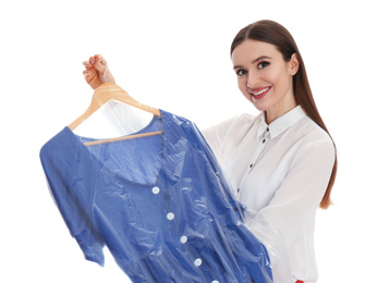 Photo of Young woman holding hanger with dress on white background. Dry-cleaning service