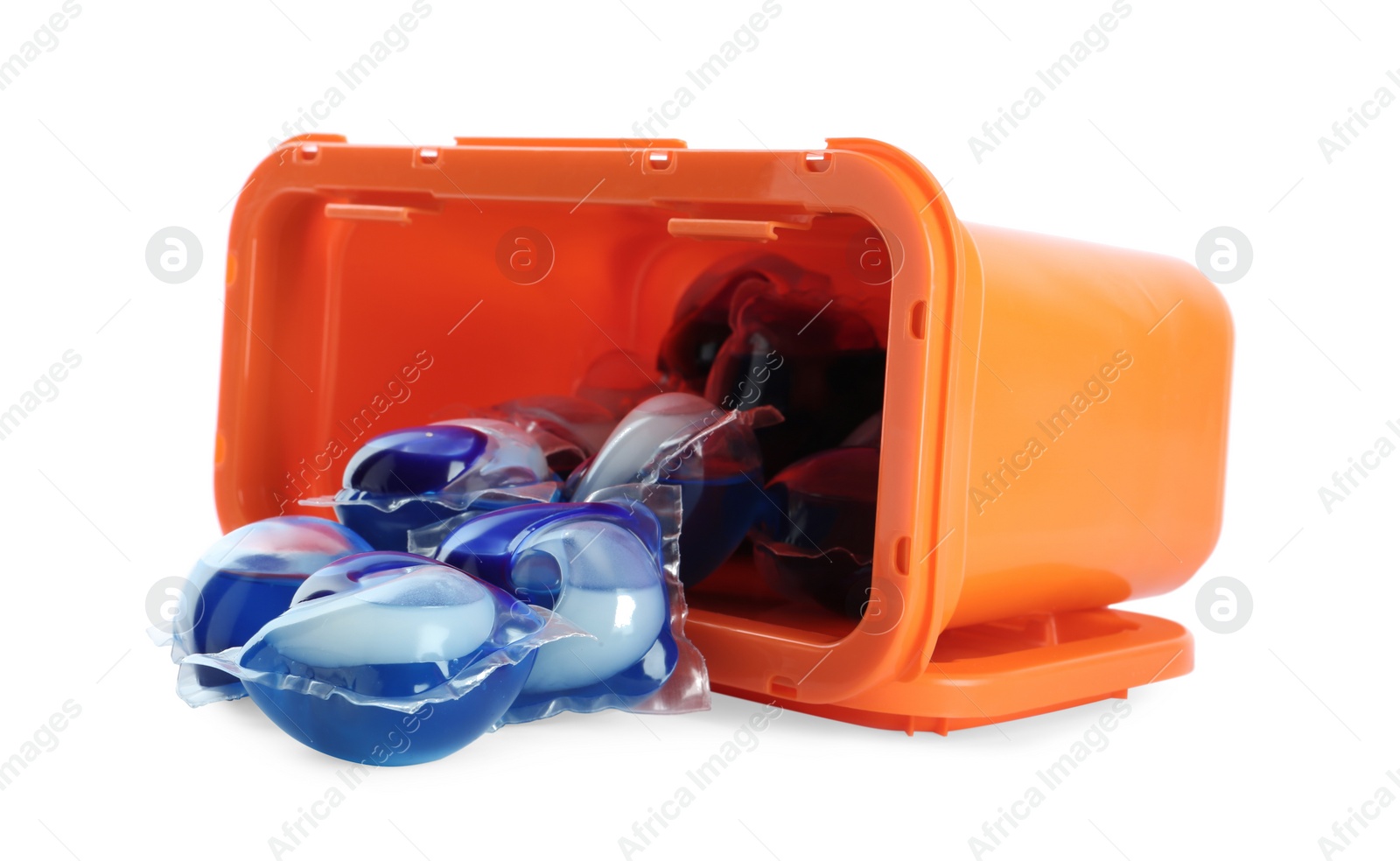 Photo of Overturned box with laundry capsules on white background