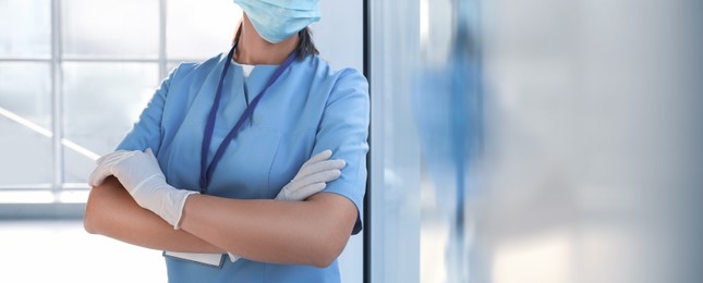 Image of Surgeon in scrubs indoors, closeup. Banner design with space for text