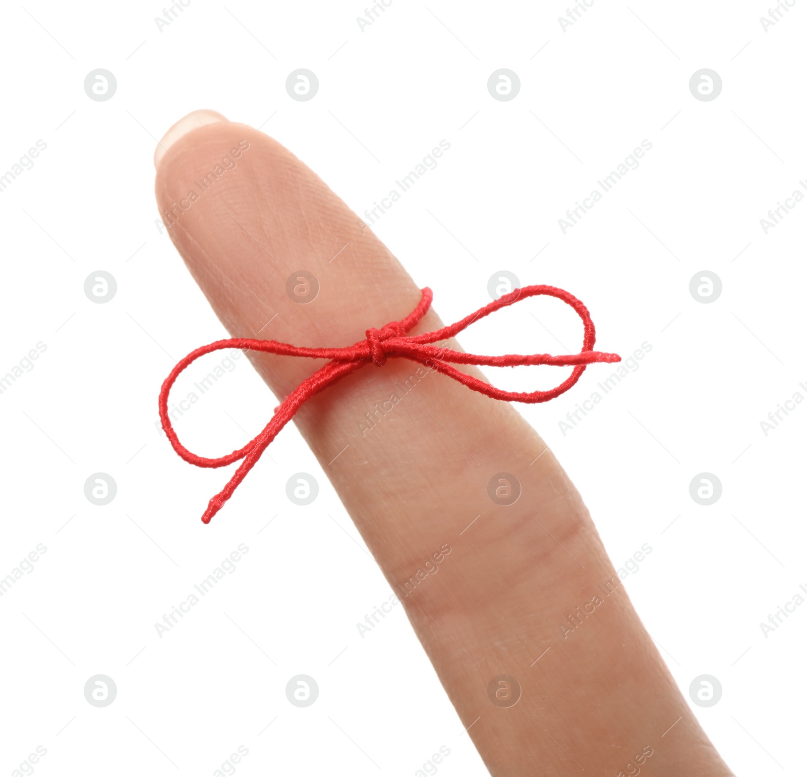 Photo of Woman showing index finger with tied red bow as reminder on white background, closeup