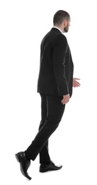 Businessman in suit on white background, back view