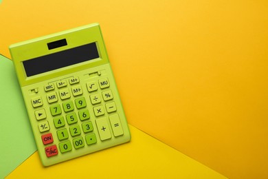 Modern calculator on color background, top view. Space for text