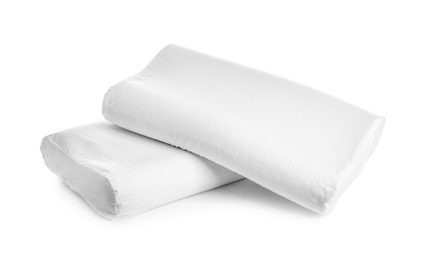 Photo of Clean soft orthopedic pillows on white background