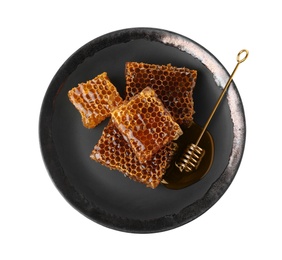 Photo of Plate with comb pieces and honey dipper isolated on white, top view