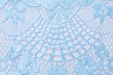 Photo of Light blue lace as background, top view