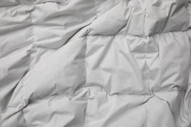 Photo of Soft crumpled blanket as background, top view