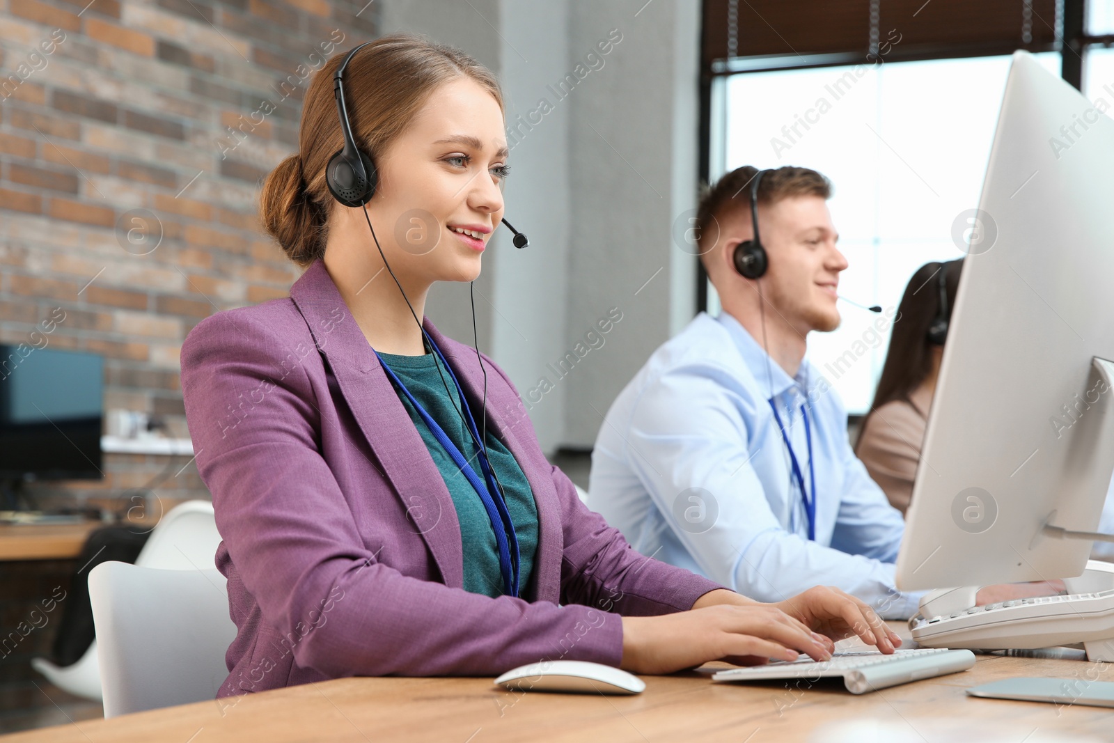 Photo of Technical support operators working in modern office