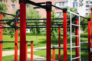 Empty outdoor gym with exercise equipment in park