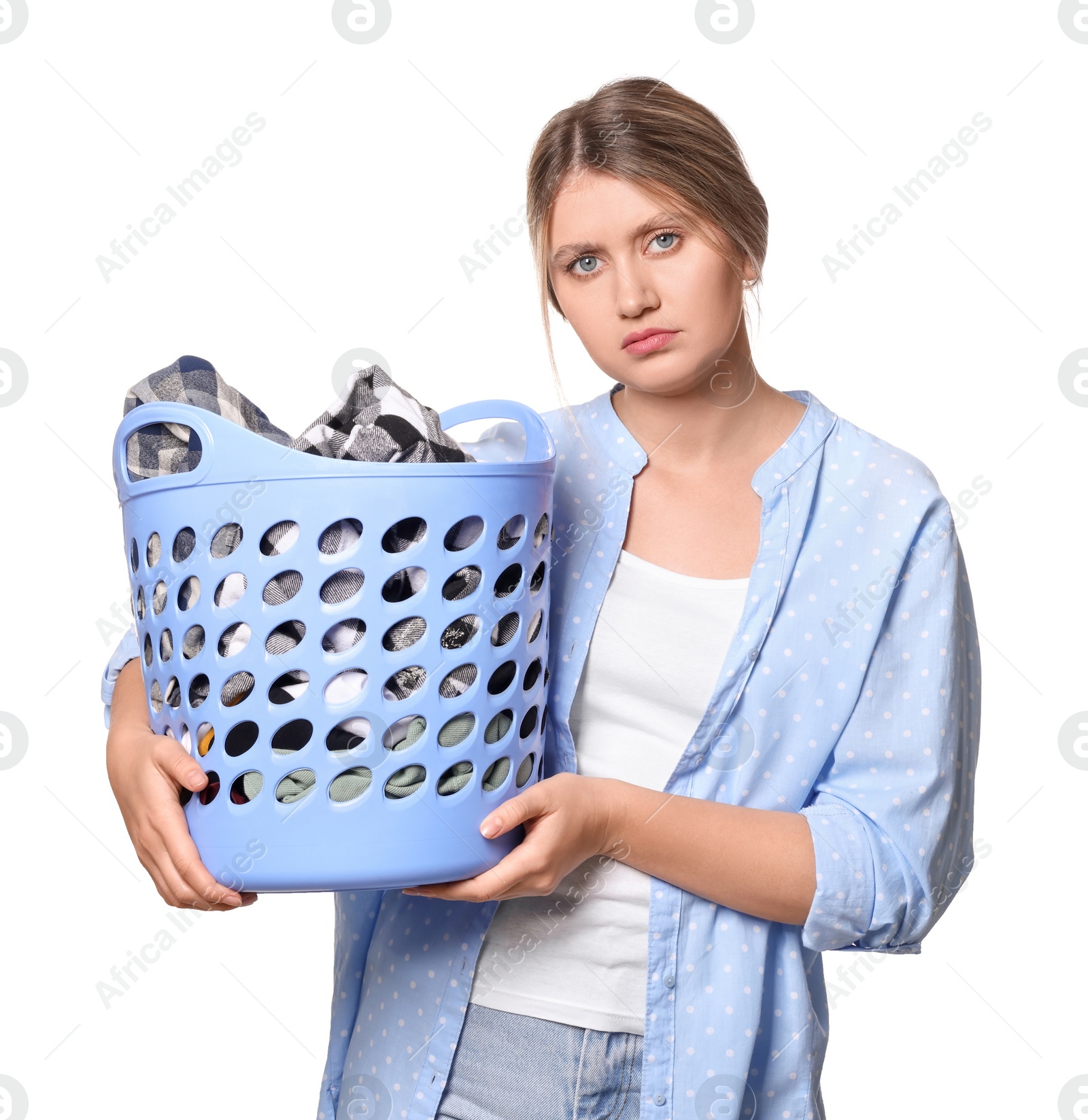 Photo of Sad woman with basket full of laundry on white background