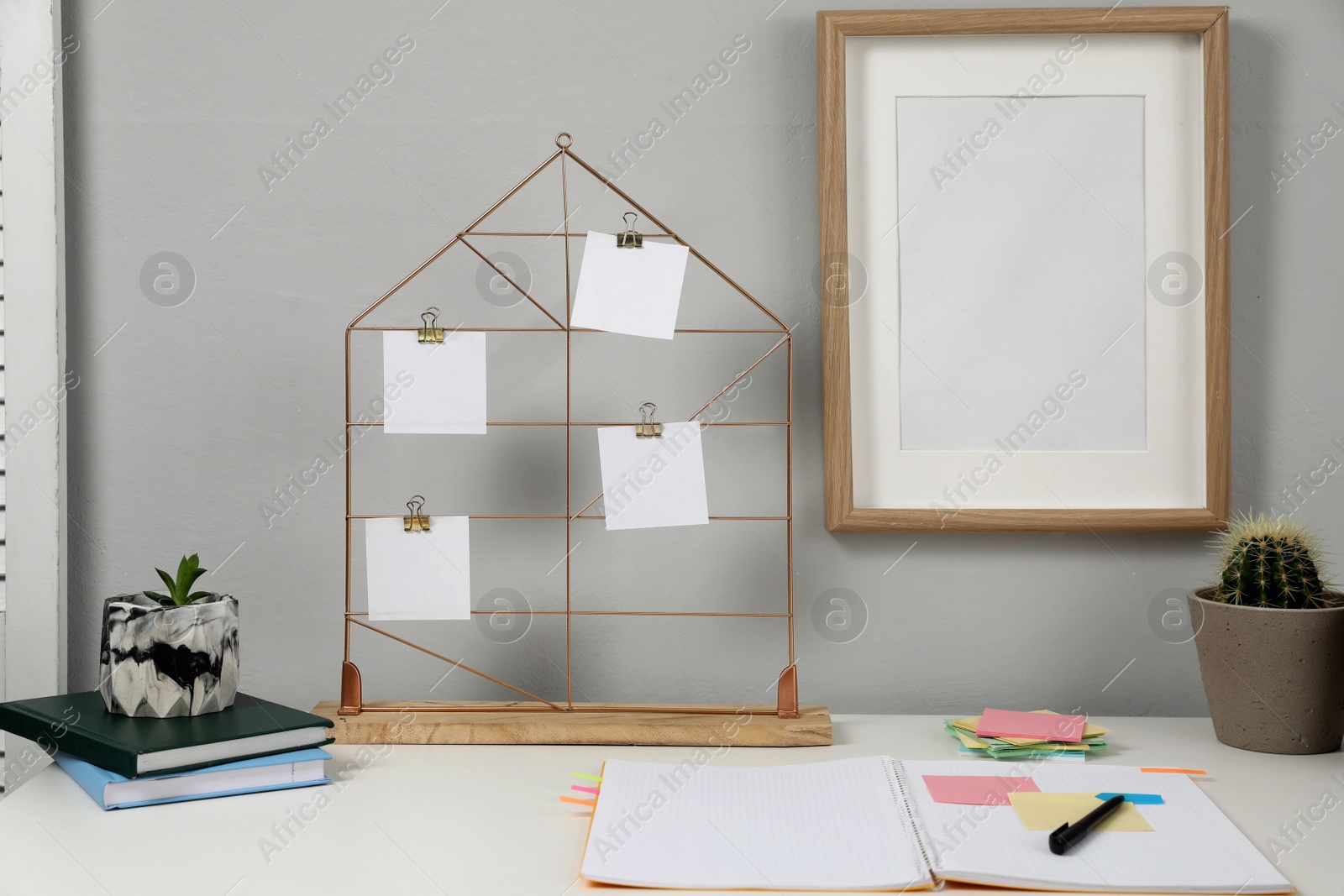 Photo of Memo board with notes on table in home office