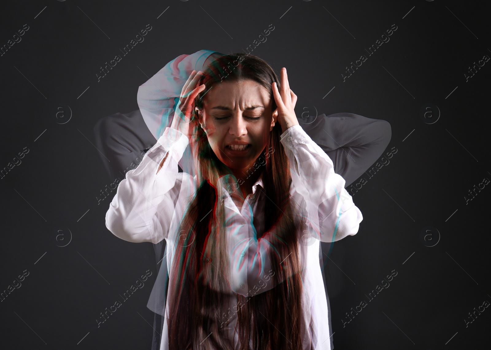 Image of Woman suffering from paranoia on dark background. Multiple exposure with photos showing emotional instability