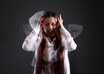 Image of Woman suffering from paranoia on dark background. Multiple exposure with photos showing emotional instability
