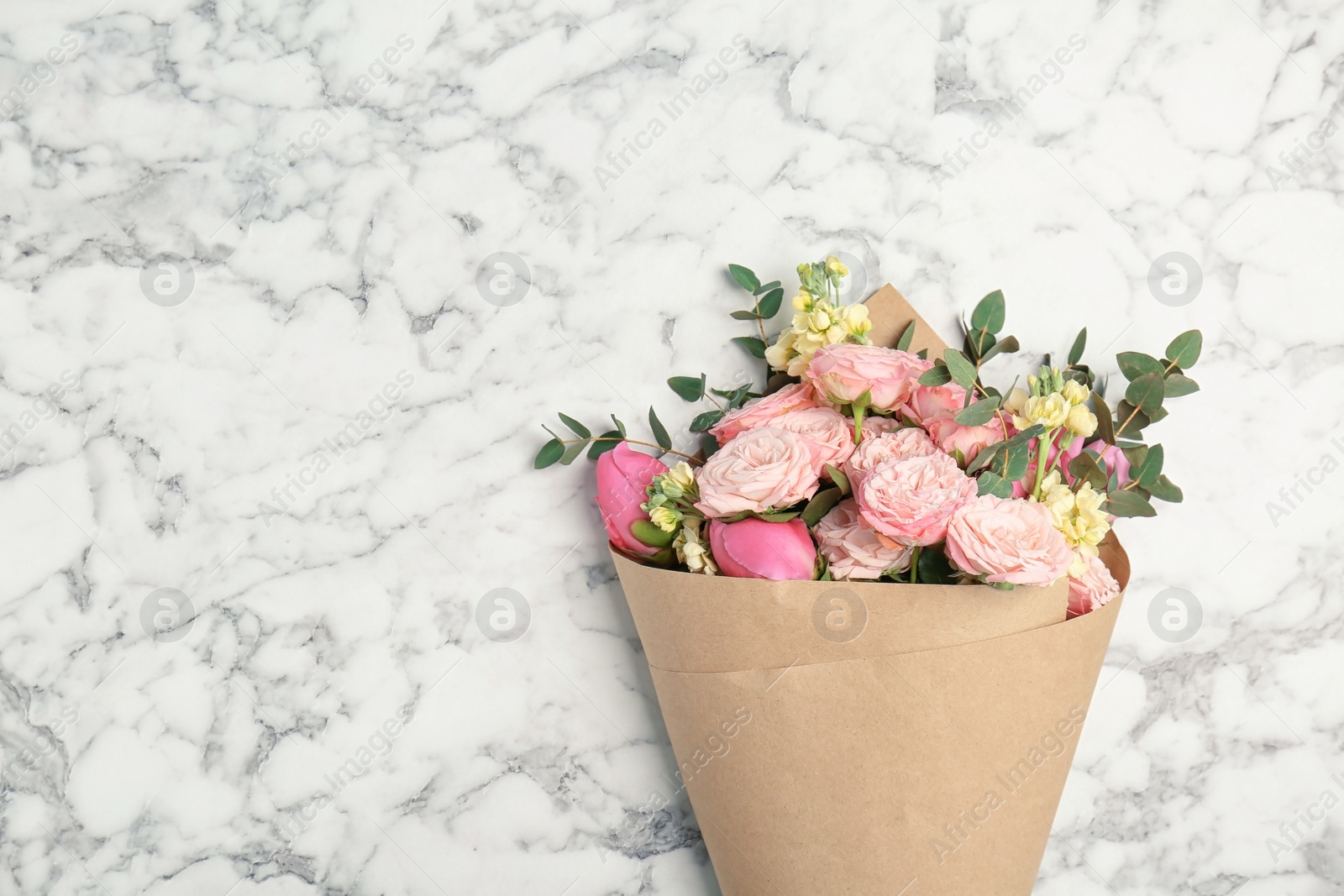 Photo of Bouquet of beautiful fragrant flowers on marble background