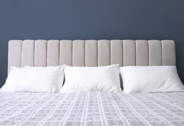 White soft pillows on comfortable bed indoors
