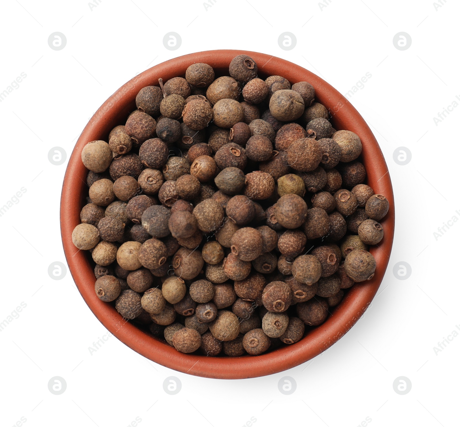 Photo of Aromatic allspice pepper grains in bowl isolated on white, top view