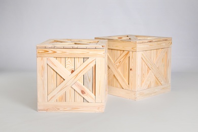 Photo of Pair of wooden crates on grey background