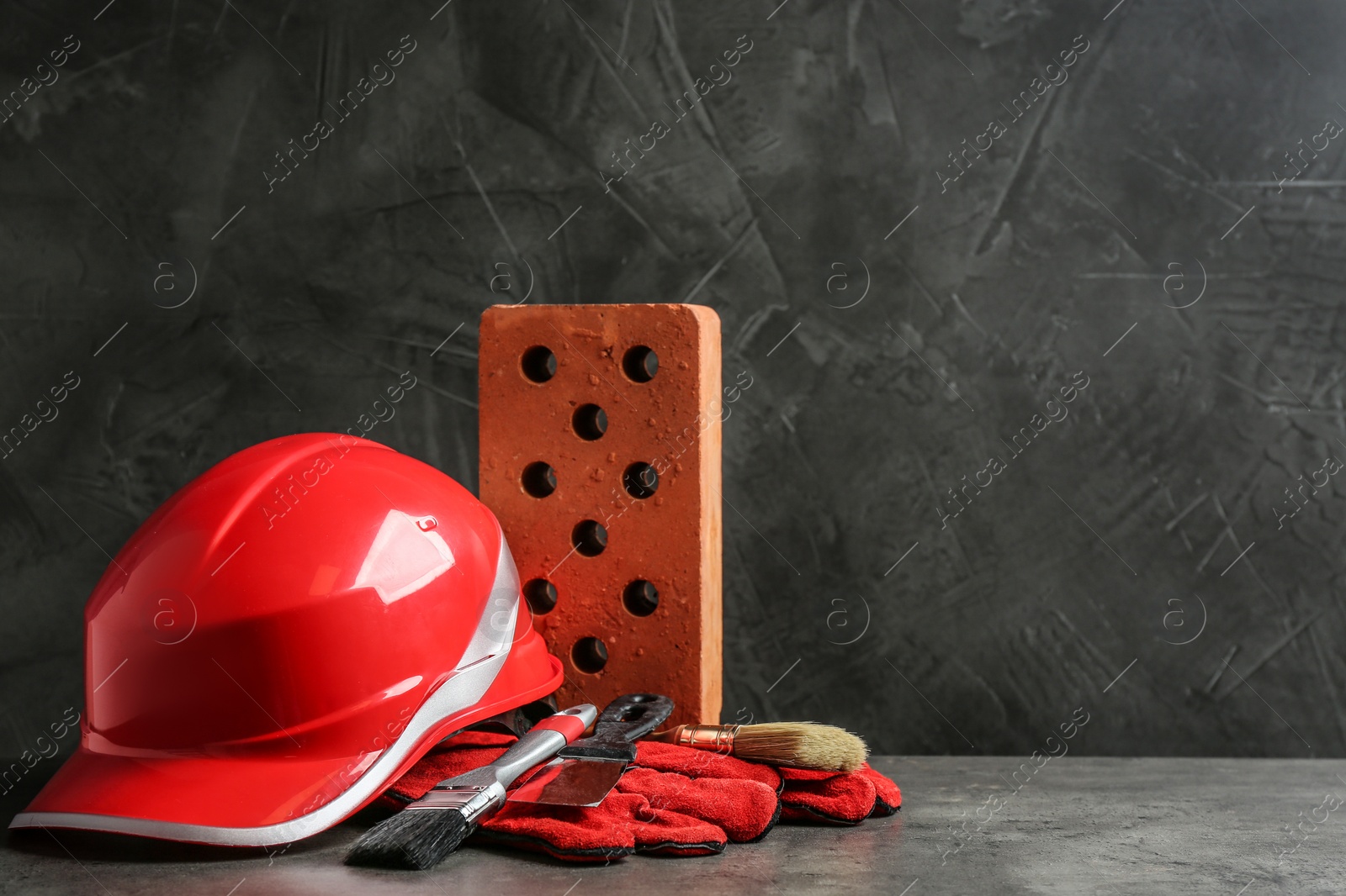 Photo of Composition with construction tools on grey table, space for text