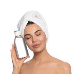 Photo of Young woman with bottle of micellar water on white background
