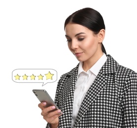 Woman leaving review online via smartphone on white background. Five stars over gadget