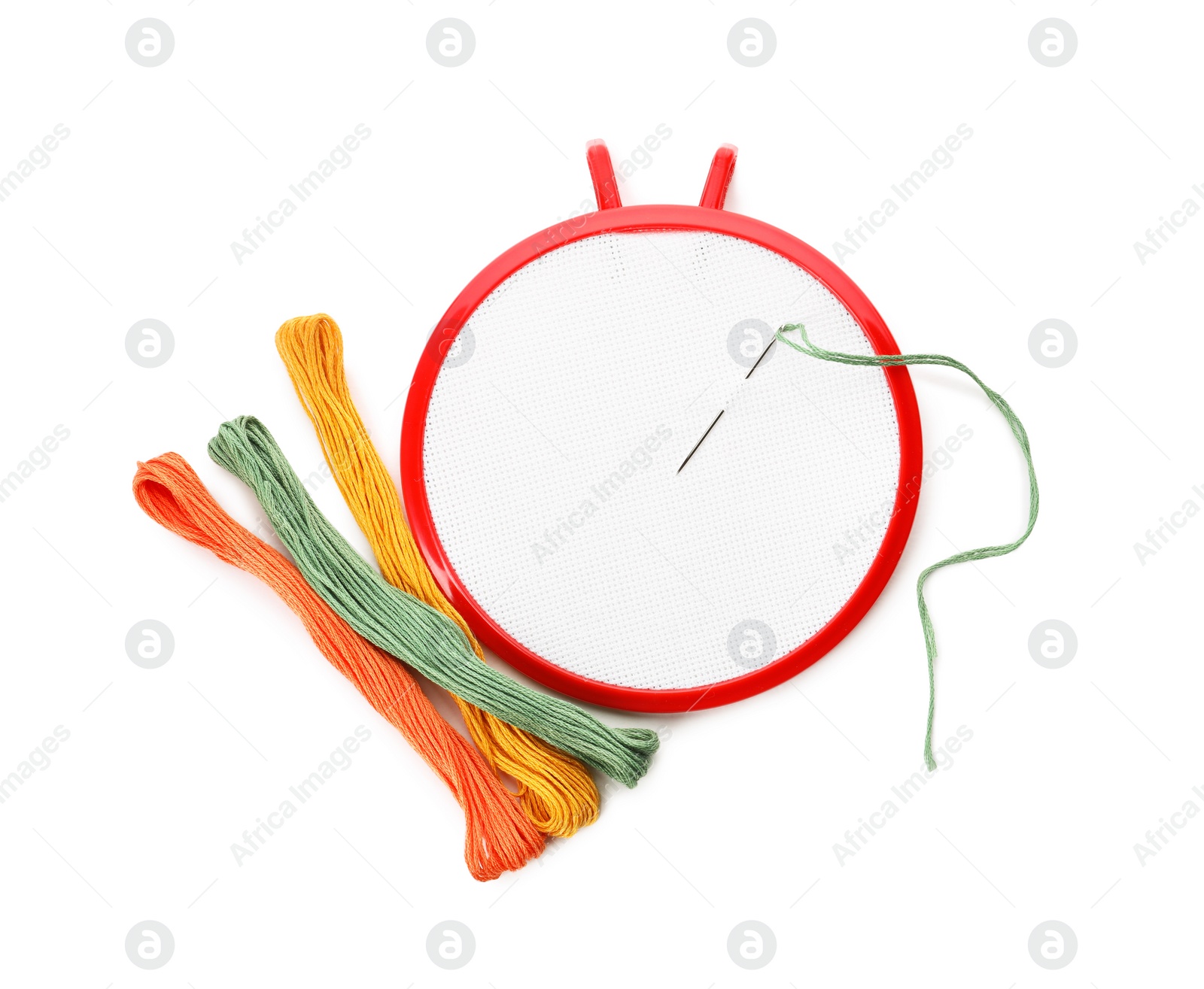 Photo of Set of embroidery equipment on white background, top view