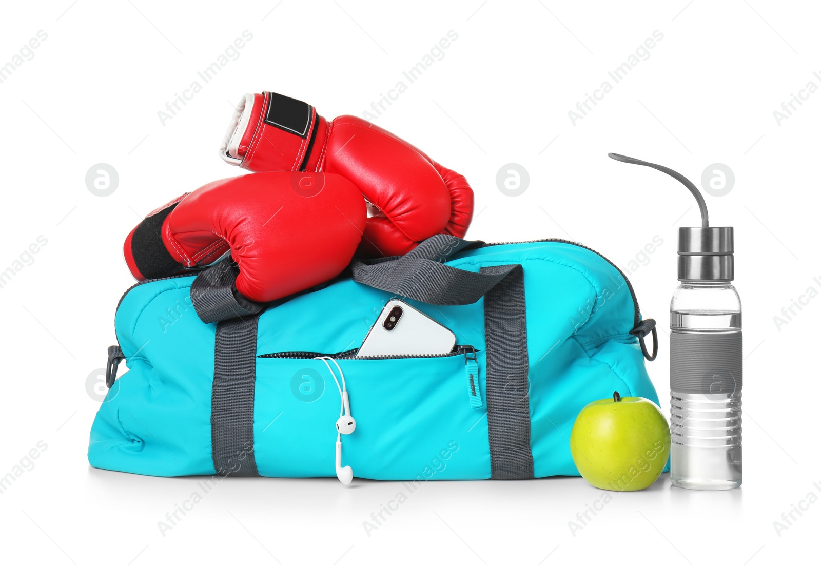 Photo of Sports bag and gym equipment on white background