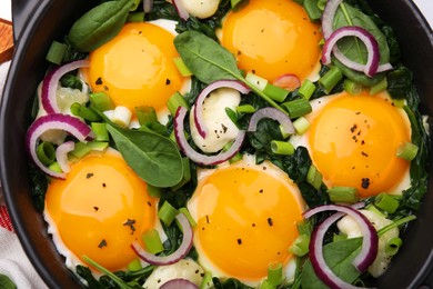 Photo of Tasty green Shakshouka in frying pan, top view