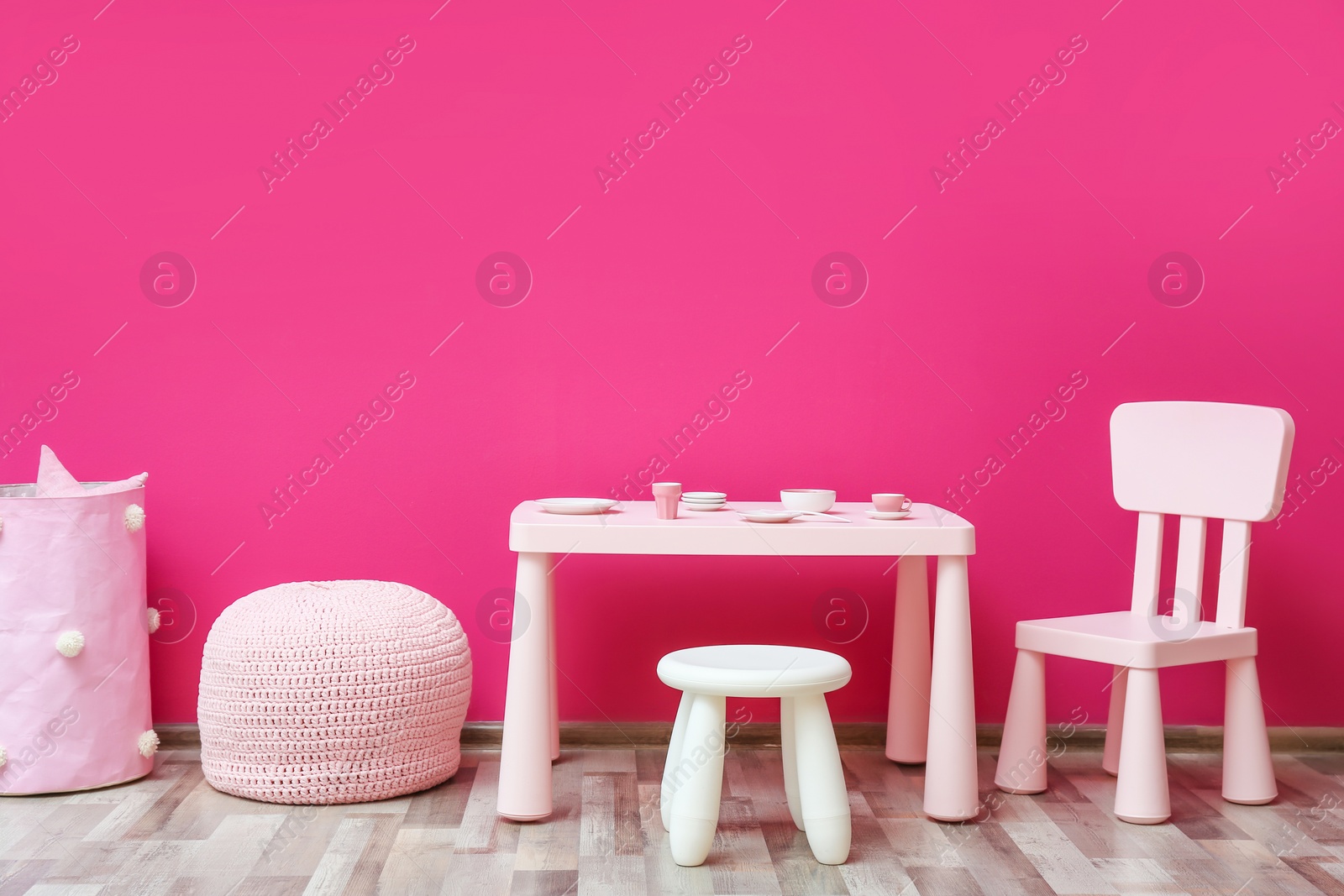 Photo of Stylish children's room interior with toys and new furniture