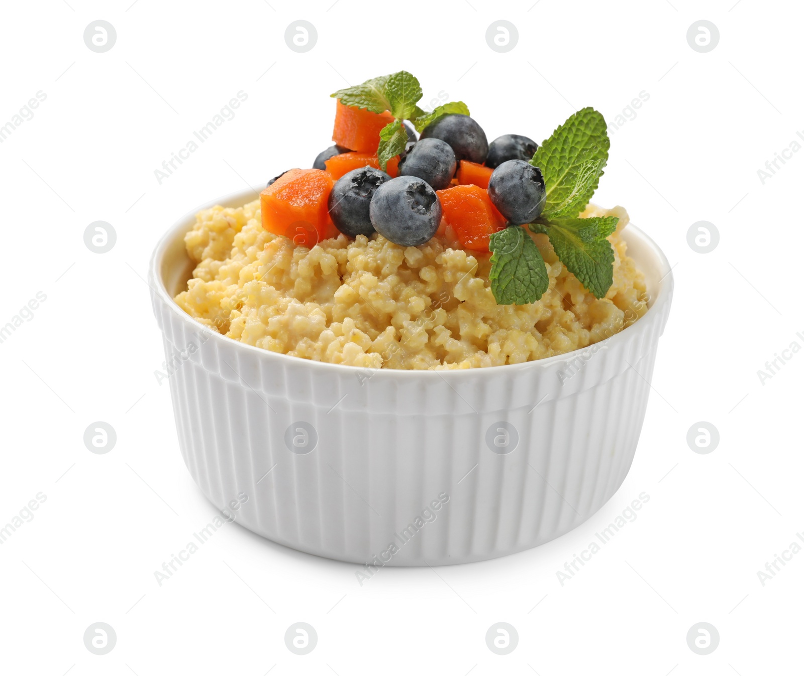 Photo of Tasty millet porridge with blueberries, pumpkin and mint in bowl isolated on white