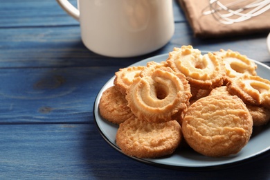 Photo of Plate with Danish butter cookies on table. Space for text