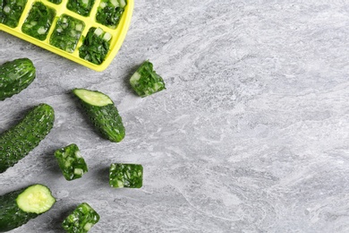 Photo of Flat lay composition with ice cube tray and space for text on table