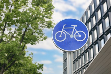 Photo of Traffic sign Cycleway on city street, low angle view. Space for text
