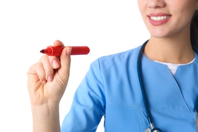 Medical student with marker on white background, closeup