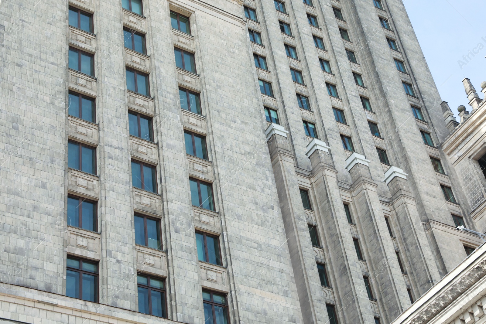 Photo of Low angle view of modern skyscraper outdoors