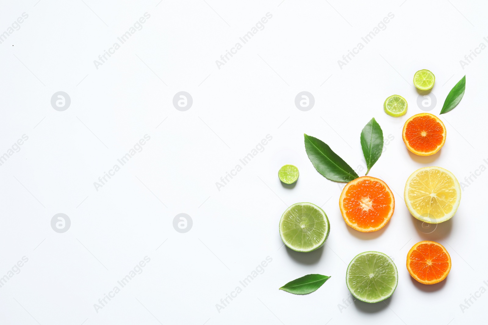 Photo of Flat lay composition with different citrus fruits on white background