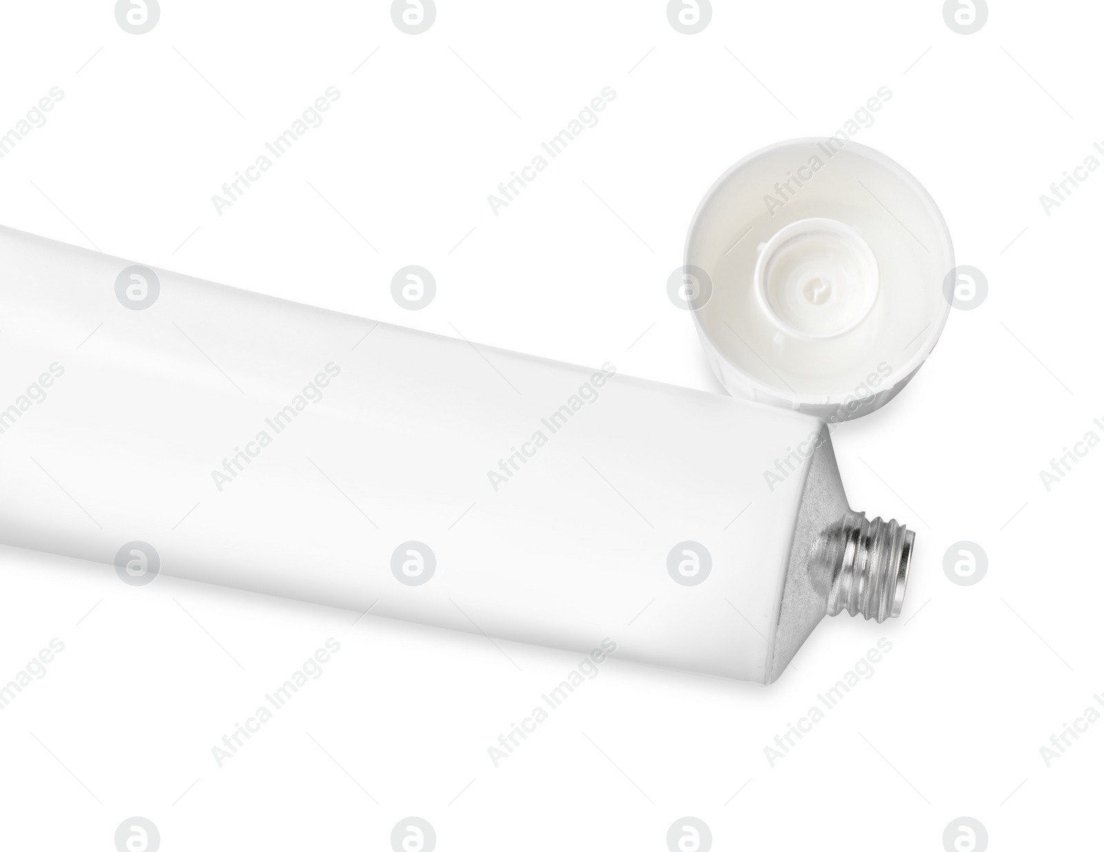 Photo of Open tube of ointment isolated on white, top view. Space for text